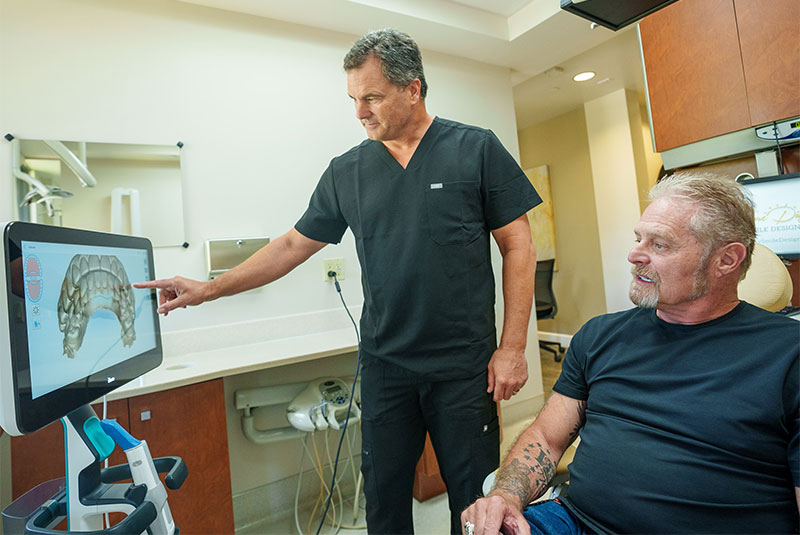 doctor pointing at xray showing patient